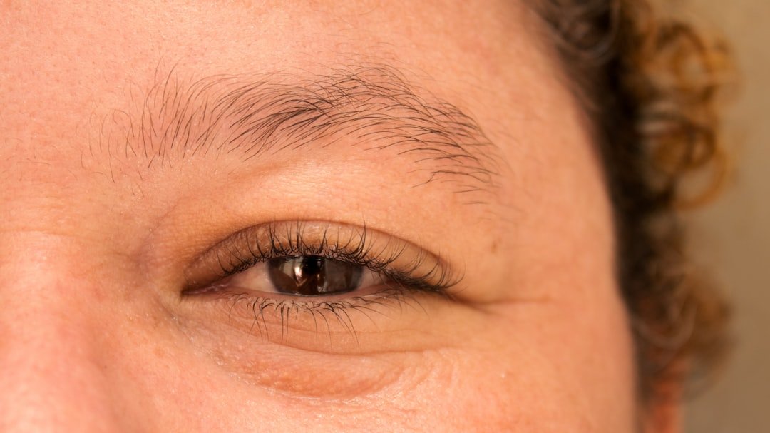 Various lash extension styles displayed on professional model